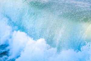 Abstract photo of waves crashing into ocean